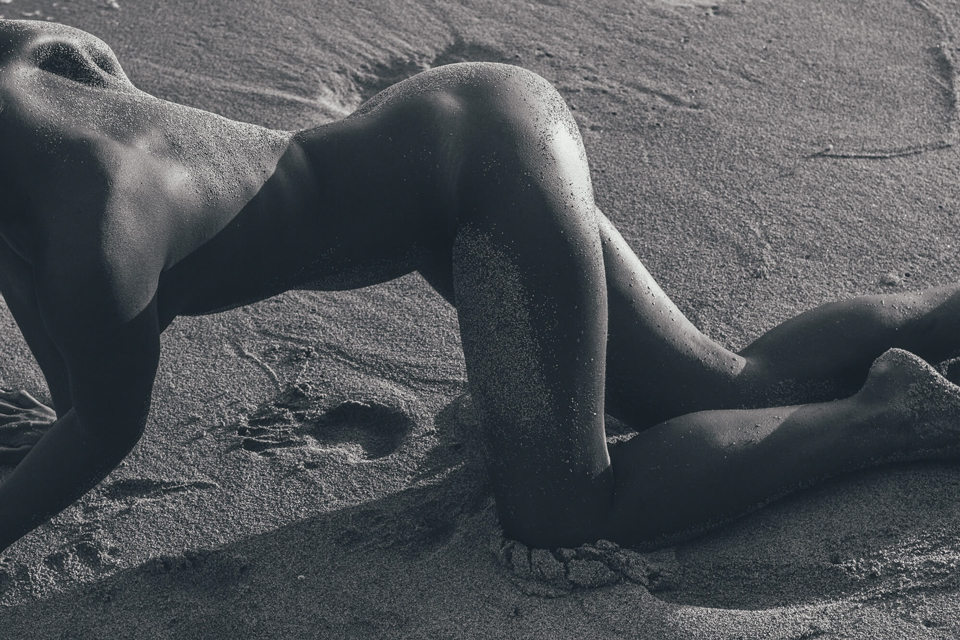 Woman body in the sand