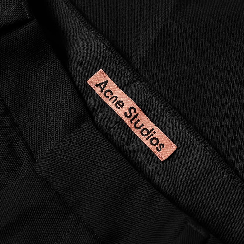 pantalon noir à pinces acne studios etiquette