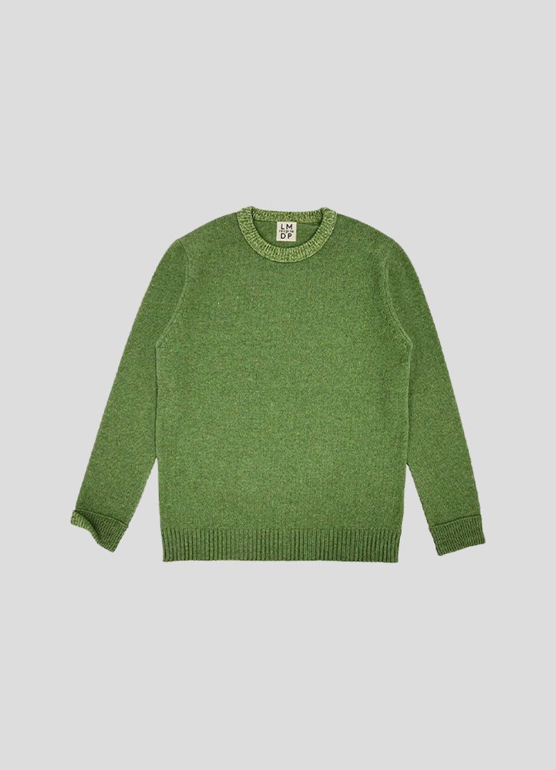 pull en laune vert mécanique du pull